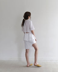 Asymmetrical White Linen Skirt with Peplum Detail and Clean Cut Hemline