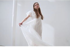Elegant Full-Length Lace Dress With Delicate Floral Texture And Soft Sheer Overlay