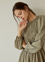 Elegant Smocked Long Sleeve Linen Midi Dress with Pleated Bodice and Flowing Skirt