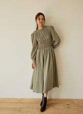 Elegant Smocked Long Sleeve Linen Midi Dress with Pleated Bodice and Flowing Skirt