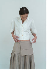 High-Waisted Pleated Linen Skirt with Structured Waistband and Modern Wrap Detail
