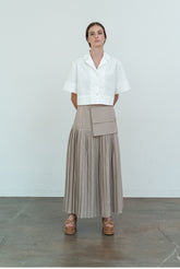 High-Waisted Pleated Linen Skirt with Structured Waistband and Modern Wrap Detail
