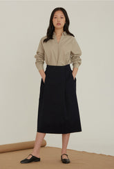 High-Waisted Linen Midi Skirt With Structured Pleats And Side Pockets