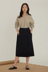 High-Waisted Linen Midi Skirt With Structured Pleats And Side Pockets