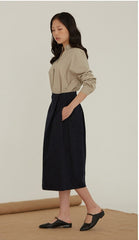 High-Waisted Linen Midi Skirt With Structured Pleats And Side Pockets