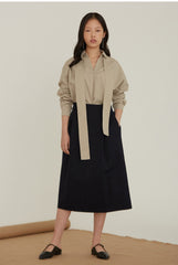 High-Waisted Linen Midi Skirt With Structured Pleats And Side Pockets