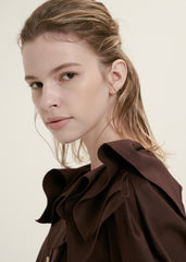 Elegant Ruffle-Collar Linen Blouse With Statement Buttons And Relaxed Tailored Silhouette