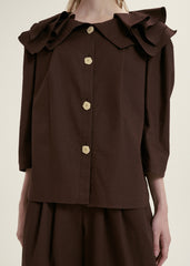 Elegant Ruffle-Collar Linen Blouse With Statement Buttons And Relaxed Tailored Silhouette