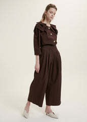 Elegant Ruffle-Collar Linen Blouse With Statement Buttons And Relaxed Tailored Silhouette