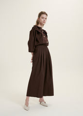Elegant Ruffle-Collar Linen Blouse With Statement Buttons And Relaxed Tailored Silhouette