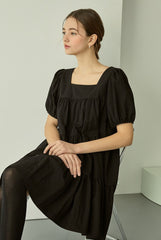 Tiered linen mini dress with square neckline and puff sleeves for effortless elegance