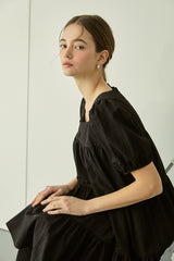 Tiered linen mini dress with square neckline and puff sleeves for effortless elegance