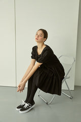 Tiered linen mini dress with square neckline and puff sleeves for effortless elegance