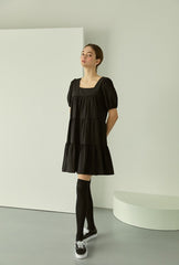 Tiered linen mini dress with square neckline and puff sleeves for effortless elegance