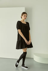 Tiered linen mini dress with square neckline and puff sleeves for effortless elegance
