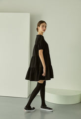 Tiered linen mini dress with square neckline and puff sleeves for effortless elegance