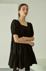 Tiered linen mini dress with square neckline and puff sleeves for effortless elegance