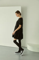Tiered linen mini dress with square neckline and puff sleeves for effortless elegance