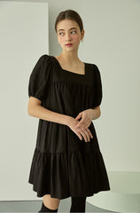 Tiered linen mini dress with square neckline and puff sleeves for effortless elegance