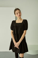Tiered linen mini dress with square neckline and puff sleeves for effortless elegance
