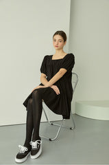 Tiered linen mini dress with square neckline and puff sleeves for effortless elegance