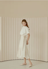 Flared Hem Linen Midi Skirt with Side Tie Detail and High Waist Silhouette