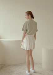 High-Waisted Pleated Mini Skirt in Lightweight Linen Blend with Side Zipper Closure