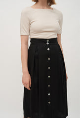 High-Waisted A-Line Linen Midi Skirt with Front Button Detail and Soft Pleat Accents