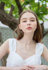 Sleeveless Linen Blouse with Peplum Hem and Button-Front Detail for Feminine Summer Style