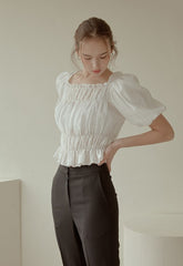 Off-Shoulder Smocked Linen Blouse With Puff Sleeves And Ruffled Hem For Elegant Casual Wear