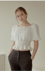 Off-Shoulder Smocked Linen Blouse With Puff Sleeves And Ruffled Hem For Elegant Casual Wear