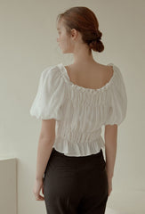 Off-Shoulder Smocked Linen Blouse With Puff Sleeves And Ruffled Hem For Elegant Casual Wear