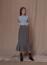 Soft cotton turtleneck top with stretch fit and minimalist tailoring for modern layering