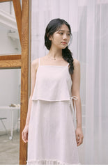 Mid-Length Flared Linen Skirt with Layered Hem and Adjustable Side Ties