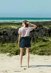 High-waisted linen mini skirt with structured silhouette and textured weave for refined summer style