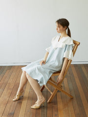 Linen Dress with Oversized Ruffle Collar and Asymmetric Hemline for Soft Feminine Statement Style