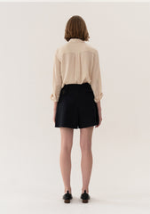 High-Waisted Tailored Linen Shorts With Adjustable Side Tabs And Minimalist Pleated Design