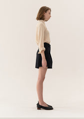 High-Waisted Tailored Linen Shorts With Adjustable Side Tabs And Minimalist Pleated Design
