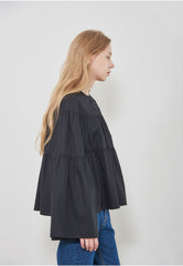 Soft-Structured Linen Blouse with Tiered Silhouette and Flared Sleeves