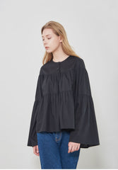 Soft-Structured Linen Blouse with Tiered Silhouette and Flared Sleeves