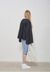 Soft-Structured Linen Blouse with Tiered Silhouette and Flared Sleeves
