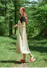 Asymmetric Button-Front Linen Dress with Spaghetti Straps and Flowing Skirt